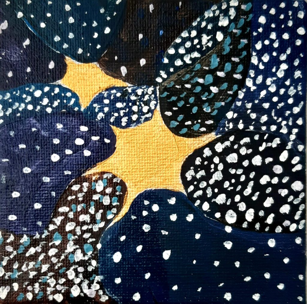 due stelle d'oro su fondo nero blu a piccole pennellate bianche